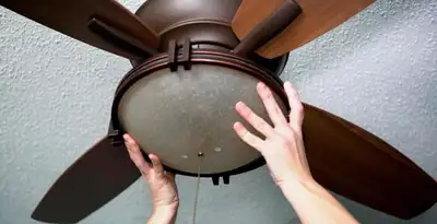 Ceiling fan repair and reinstallation on ceiling mount in Overland Park, KS