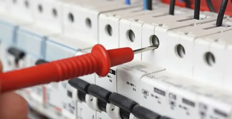 Electrical contractor testing circuit breakers during electrical repair in Lenexa, KS