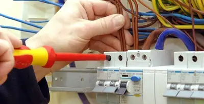 electrician services performing professional electrical panel wiring and connections in Overland Park, KS