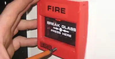 fire alarm installation service showing manual fire alarm pull station installed by licensed electricians in Overland Park, KS