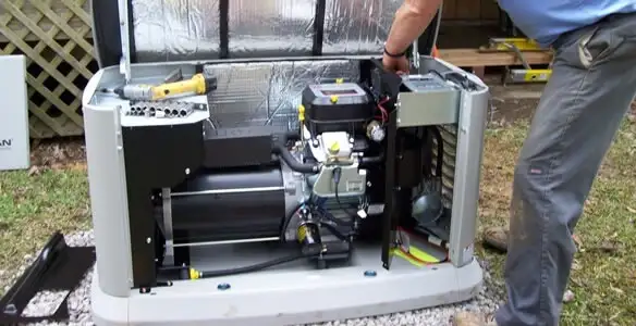 generator installation service showing technician connecting and configuring generator components in Overland Park, KS