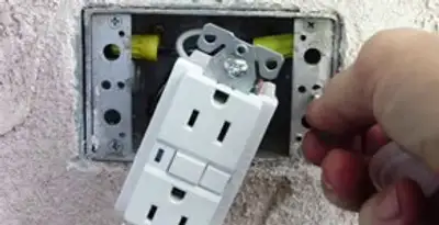 gfci circuits service showing installation of a ground fault circuit interrupter outlet by licensed electricians in Overland Park, KS