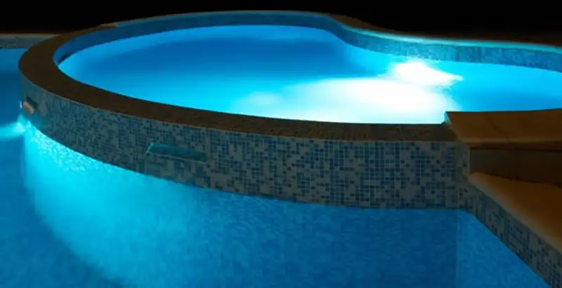 pool light installation and repair services highlighting illuminated pool interior lighting in Overland Park, KS