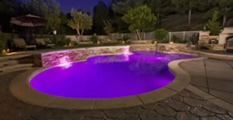 pool light installation and repair services illuminating a residential swimming pool in Overland Park, KS