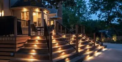 Residential electrician installing outdoor lighting for home safety in Overland Park, KS