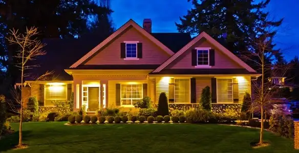 security light installation services illuminating a residential exterior at night in Overland Park, KS