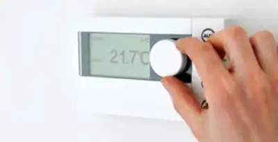 Thermostat installation service with professional adjusting temperature control in Overland Park, KS