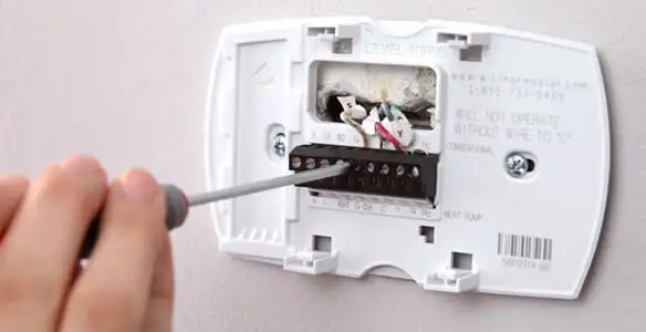 Thermostat installation service with proper wiring and secure wall mounting in Overland Park, KS