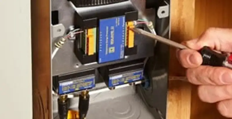 Whole home surge protection device being installed by a licensed electrician to protect electrical systems in Overland Park, KS